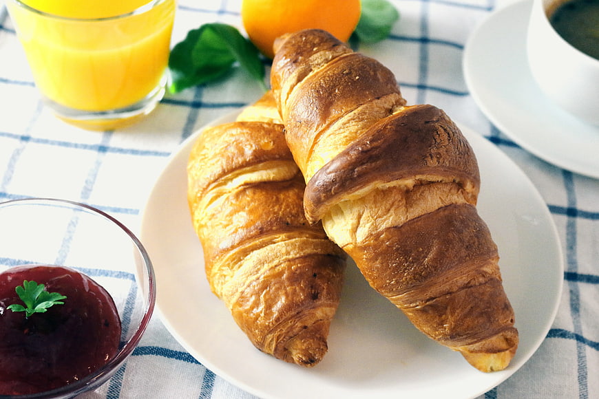 Fresh Croissants with Orange Juice and Jam Breakfast