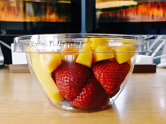 Fresh Cut Mango and Strawberries in Clear Plastic Bowl