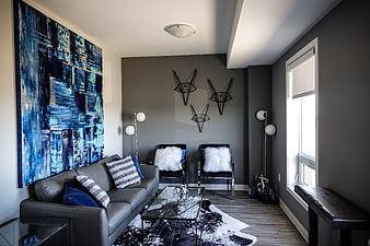 Modern Living Room Interior With Blue Abstract Art And Grey Sofa