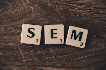 SEM Scrabble Tiles on Dark Wood Background
