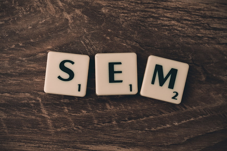 SEM Scrabble Tiles on Dark Wood Background