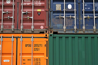 Stacked colorful shipping containers in industrial port