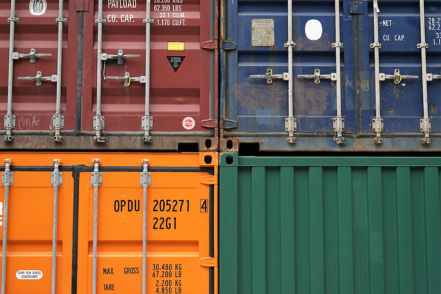 Stacked colorful shipping containers in industrial port