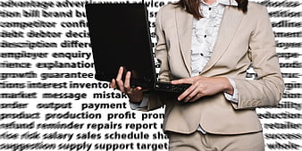 Businesswoman holding laptop against business word cloud background