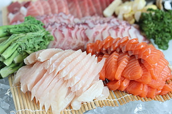 Fresh Sashimi Platter With Salmon, White Fish, And Tuna On Bamboo Mat
