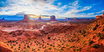 Panoramic View of Monument Valley at Sunrise with Red Rock Buttes