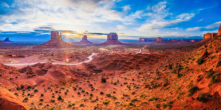 Panoramic View of Monument Valley at Sunrise with Red Rock Buttes
