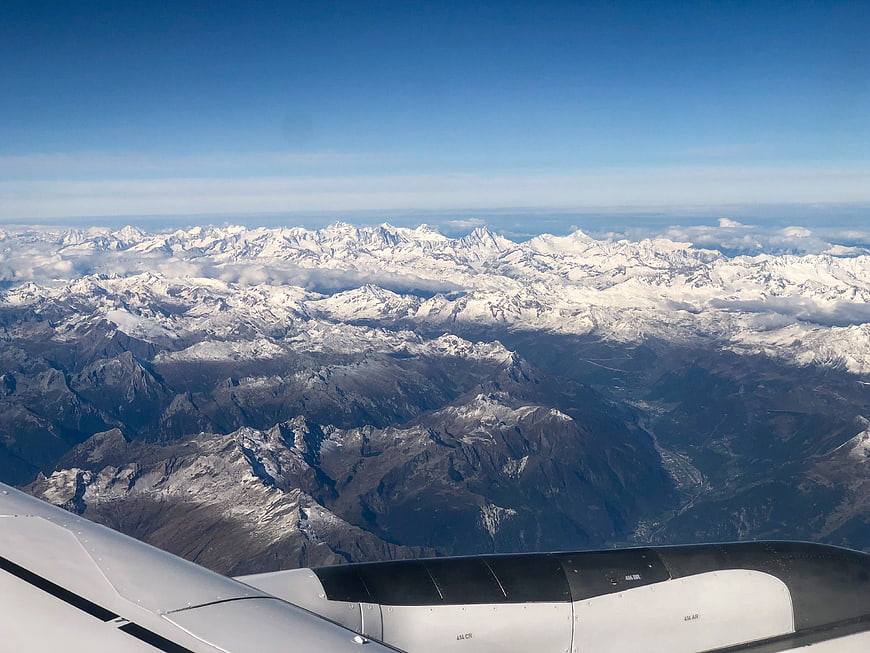 Aerial view of snow-capped mountains from airplane window
