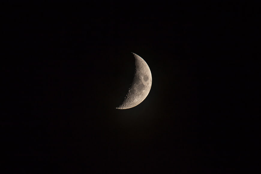 Crescent Moon in Dark Night Sky