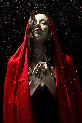 Woman in Red Hood with Water Droplets