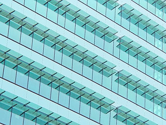 Abstract modern glass building facade with geometric window pattern