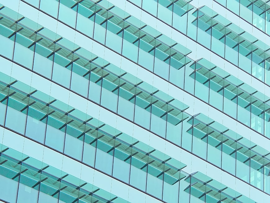 Abstract modern glass building facade with geometric window pattern