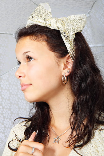 Woman with Lace Bow Headband and Star Necklace