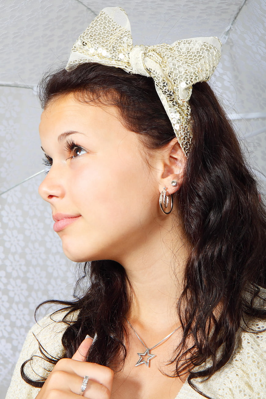 Woman with Lace Bow Headband and Star Necklace