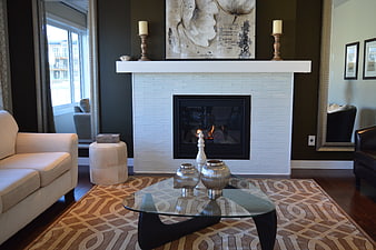 Modern Living Room with White Brick Fireplace and Glass Coffee Table