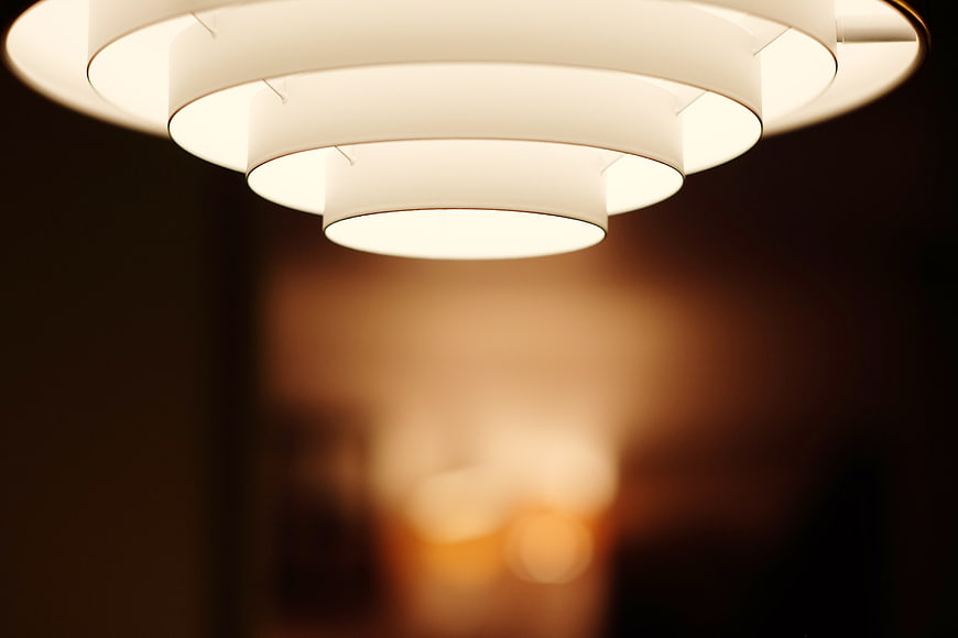 Modern tiered white ceiling lamp with warm ambient lighting