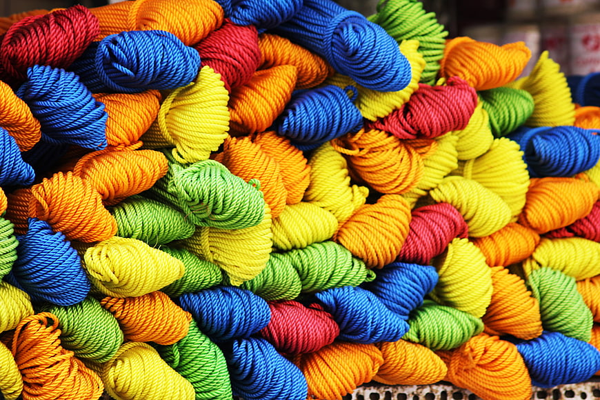 Colorful skeins of yarn in vibrant rainbow colors