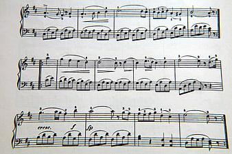 Handwritten Piano Sheet Music Score on White Paper