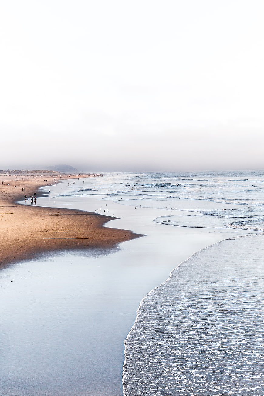 Serene Beach Landscape with Gentle Waves and Sandy Shore