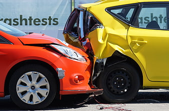 Crash Test Collision of Orange and Yellow Cars
