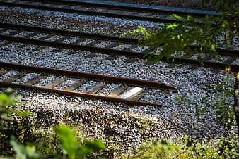 Broken railway track with broken rail on gravel bed