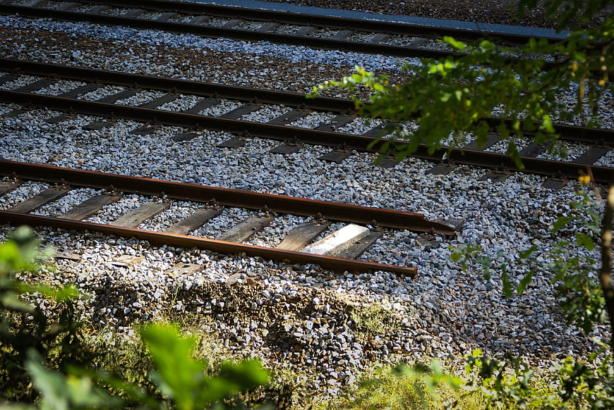 Broken railway track with broken rail on gravel bed