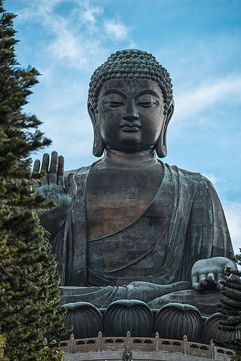 Low angle view of Tian Tan Buddha statue in Hong Kong