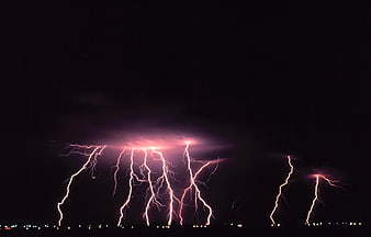 Dramatic Night Lightning Storm Over City Skyline