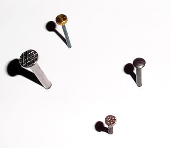 Assorted metal nails on white background