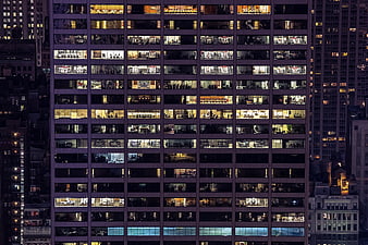 Night view of illuminated office building windows in city