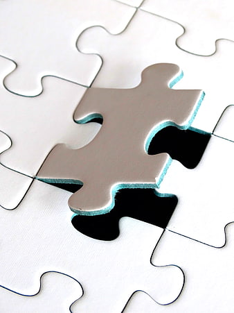 Missing white puzzle piece on black background