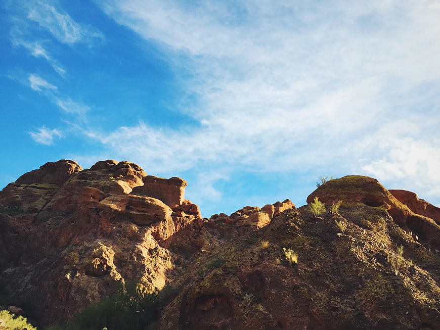 Low Angle View of Red Rock Mountain Under Blue Sky