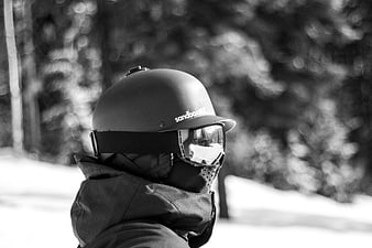 Black and white portrait of skier in helmet and goggles