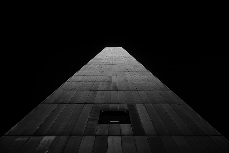 Low angle black and white skyscraper facade