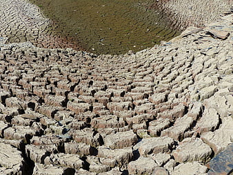 Cracked dry mud texture in dried riverbed