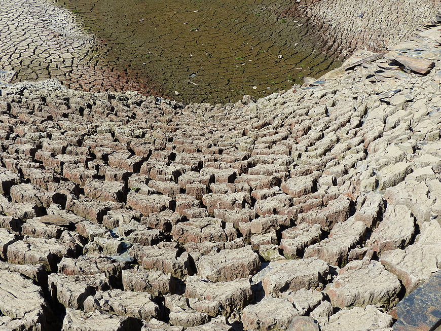 Cracked dry mud texture in dried riverbed