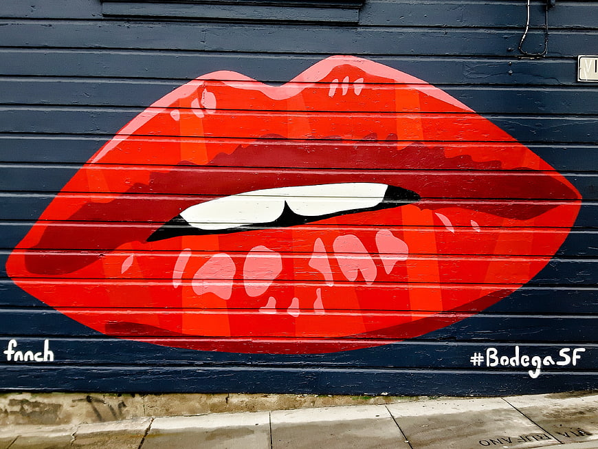 Red Lips Graffiti on Blue Wall