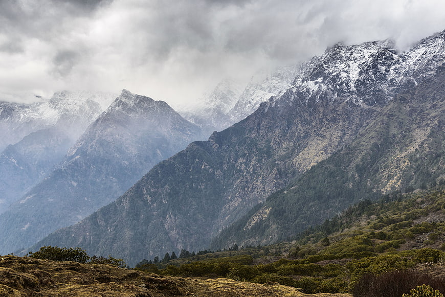 Majestic Snow-Capped Mountain Peaks Under Dramatic Clouds