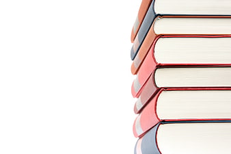 Stack of colorful hardcover books on white background