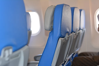 Blue Airplane Seats In A Row With Window View