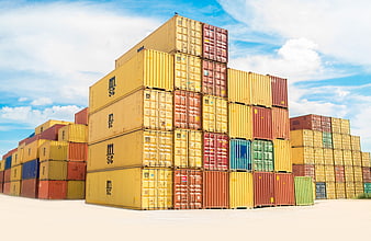 Stacked Shipping Containers in Cargo Yard Under Blue Sky