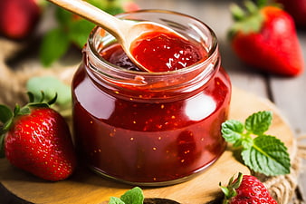 Homemade Strawberry Jam in Glass Jar with Fresh Berries