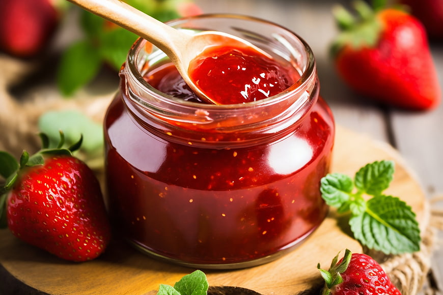 Homemade Strawberry Jam in Glass Jar with Fresh Berries
