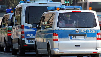Rear View Of German Police Vans In Traffic