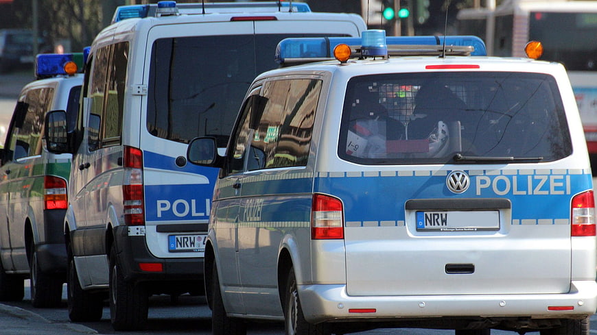 Rear View Of German Police Vans In Traffic