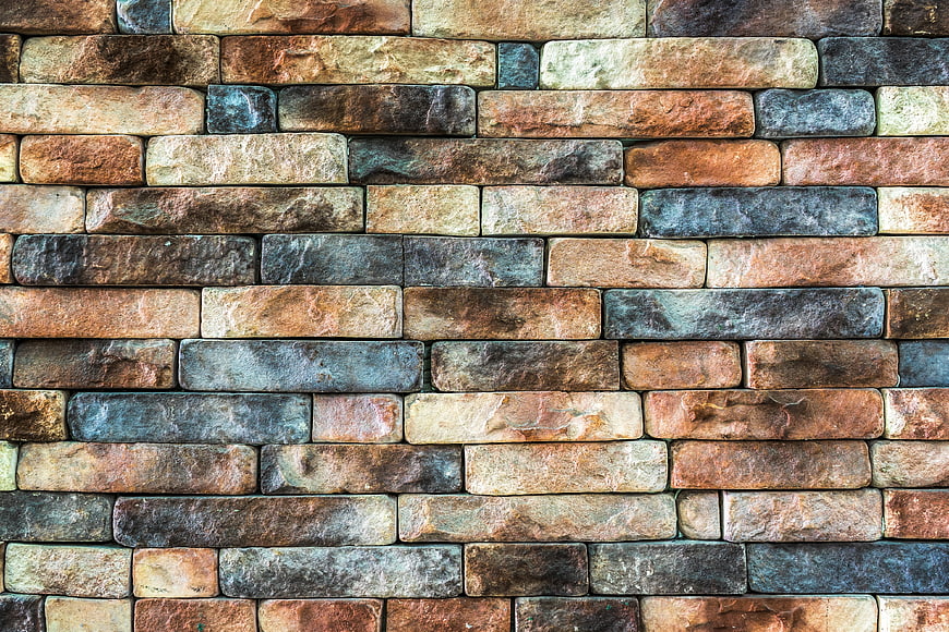 Textured Multi-Color Stone Brick Wall Background