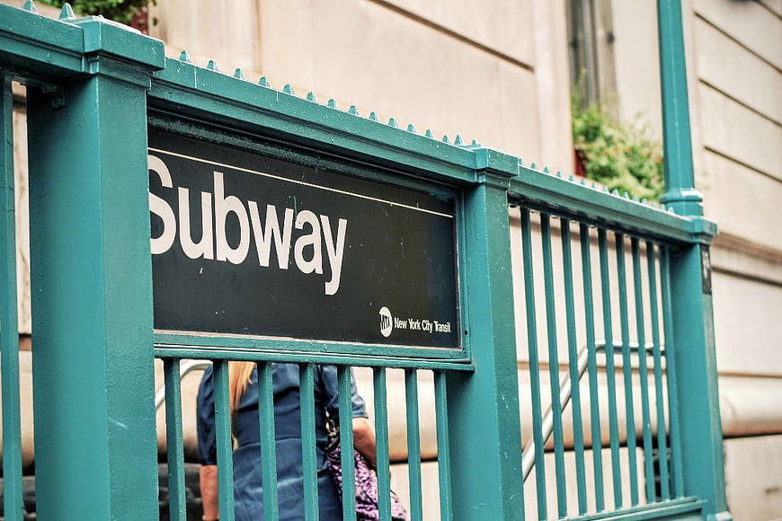 New York City Subway Entrance Sign on Green Gate