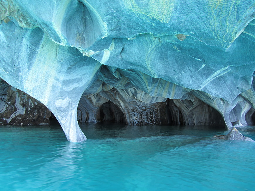 Turquoise Marble Cave Interior with Blue Water