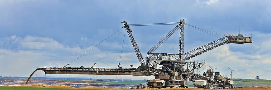 Gigantic Bucket Wheel Excavator Operating In Open Pit Mining Site