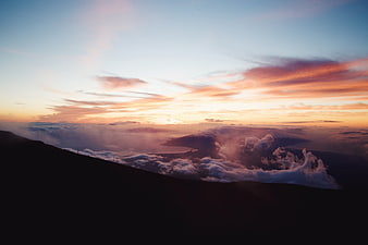 Dramatic Sunset Over Mountain Ridge and Cloud Sea